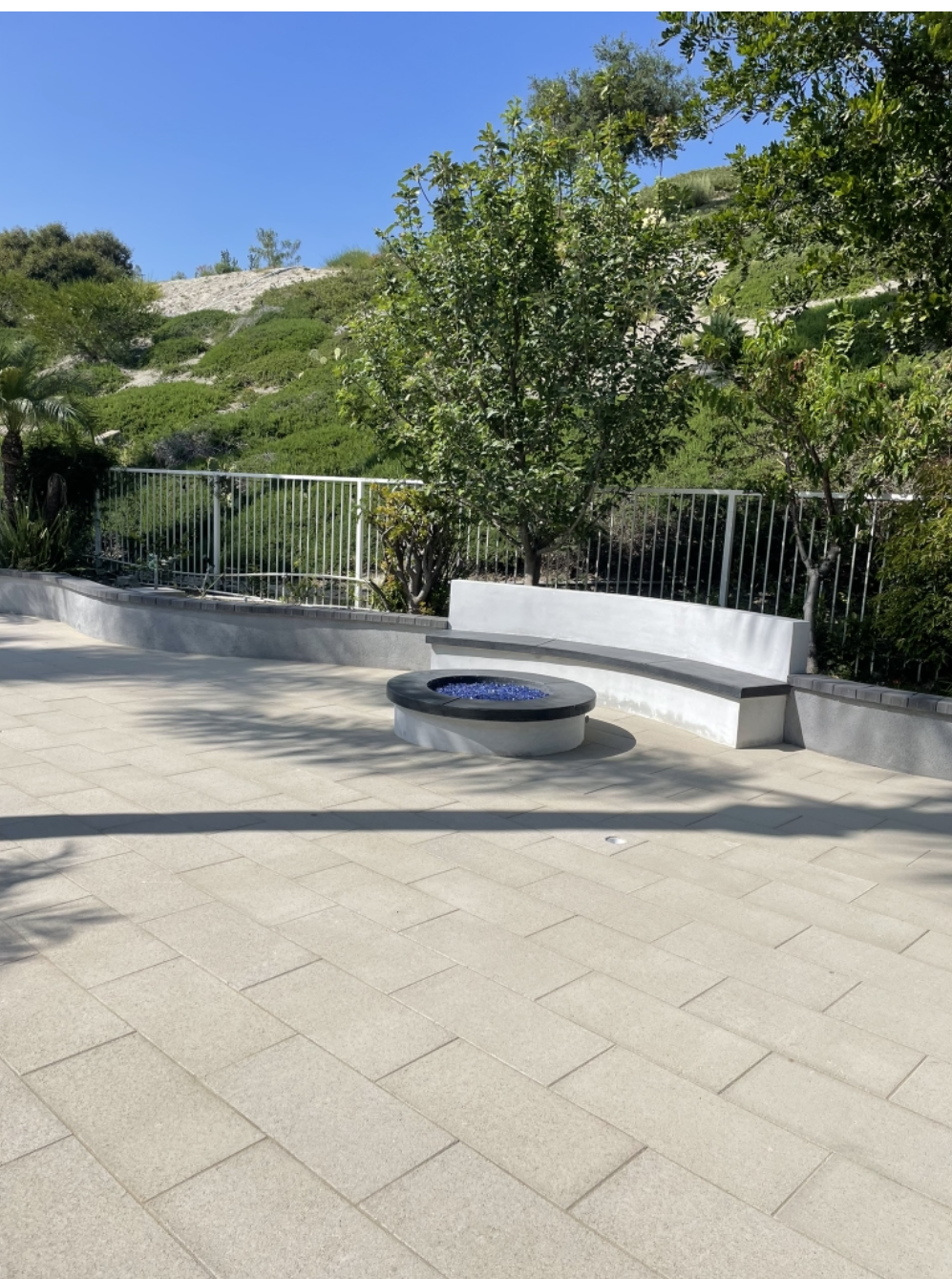 Paver patio with fire pit built by CLG